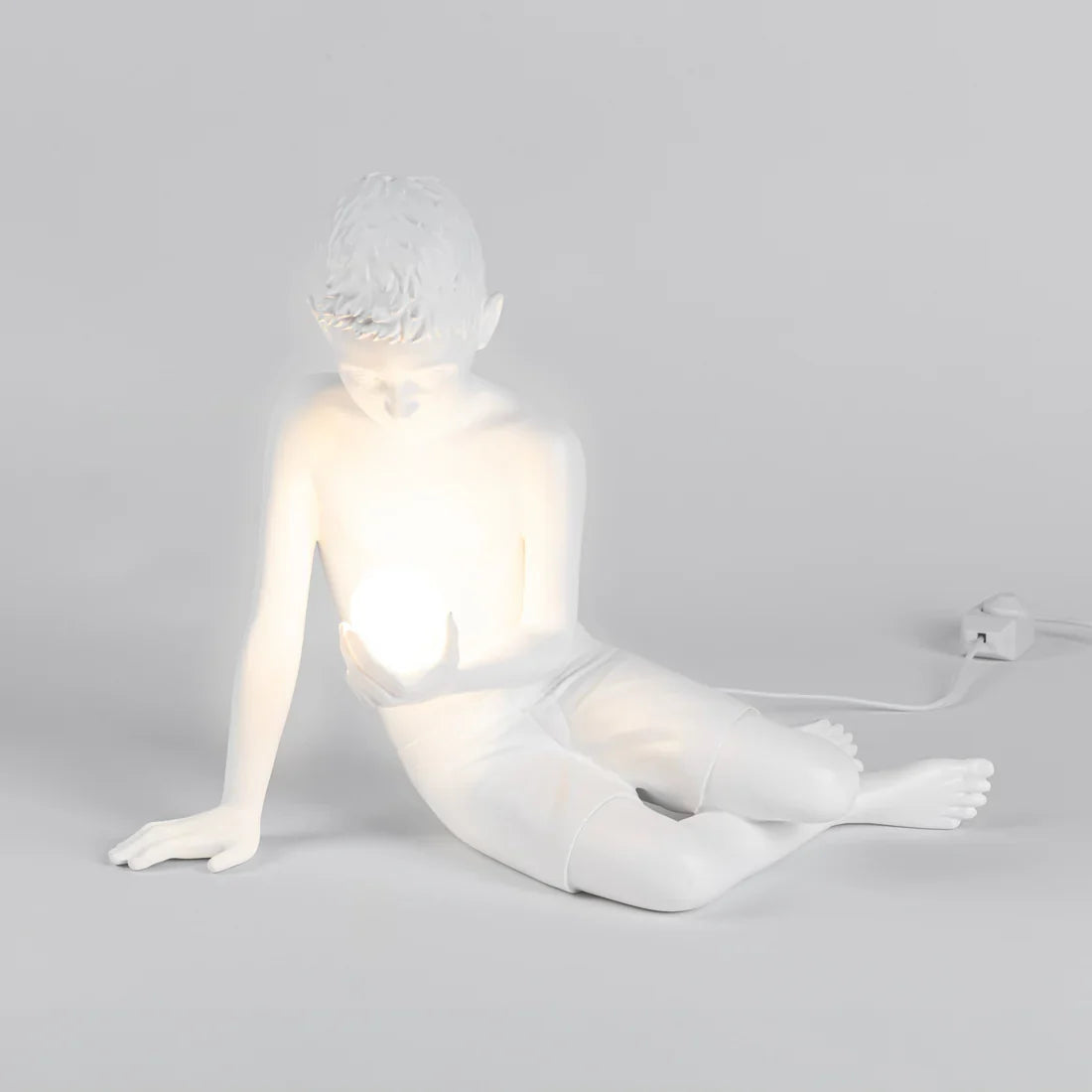 SELETTI - SCULTURA IN RESINA CON LUCE LED "INNER GLOW_S" BOY